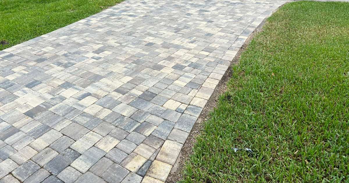 Paver driveway leading to the street apron at a Ponte Vedra, Jacksonville home